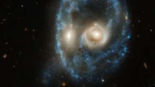 К Хэллоуину NASA опубликовало снимок скопления галактик в виде устращающего лица